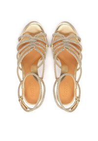 Golden high-heeled sandals with multiple rhinestone-embellished straps, open toe, and a light brown leather insole. Adjustable ankle strap.