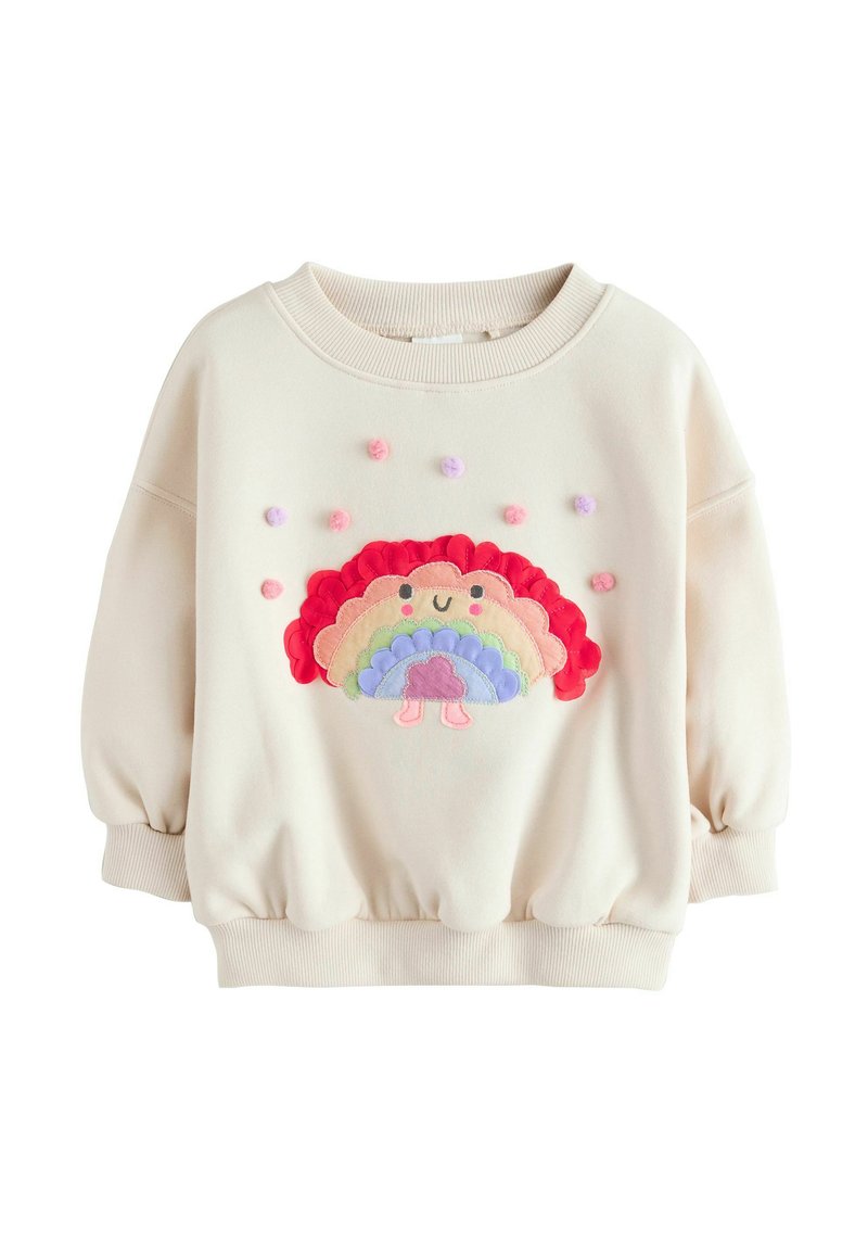 Cremfarbener Sweatshirt mit Puffärmeln, das ein farbenfrohes, gesticktes Regenbogenmuster und strukturierte Pompoms auf der Vorderseite aufweist.