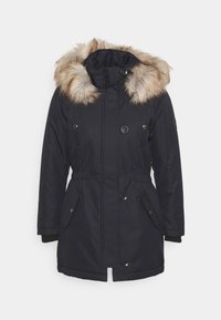 Mörk marinblå parka med huva i faux päls, elastisk midja och stora framfickor. Har tryckknappar och ribbad mudd.