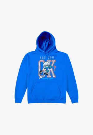 Sweat à capuche bleu avec le texte "ÇA VA?", avec un Schtroumpf déguisé en joueur de hockey tenant une crosse à l'avant.
