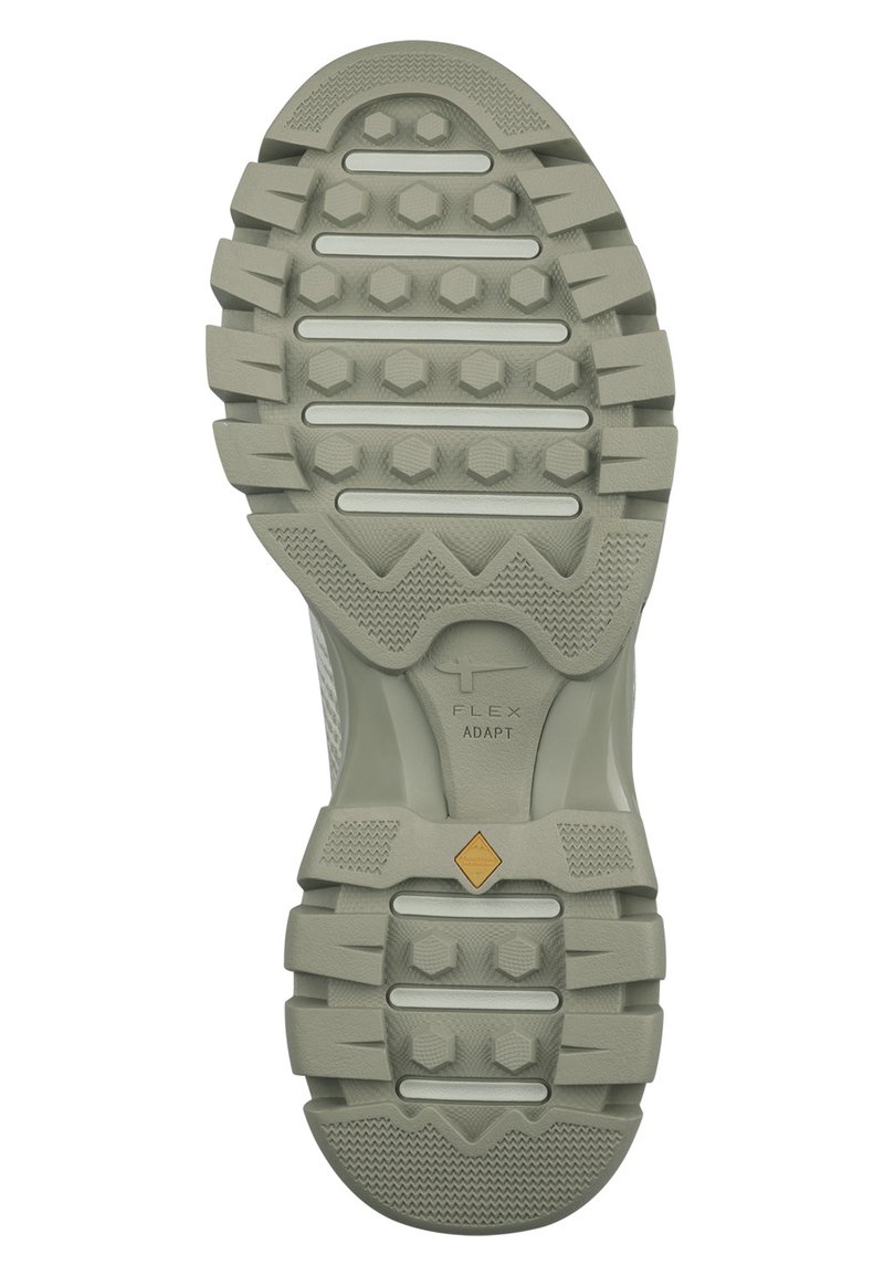 Helle graue Gummisohle mit texturierten Grip-Mustern, einschließlich hexagonaler Stollen und Rillen für Traktion. Verfügt über das FLEX ADAPT-Branding.