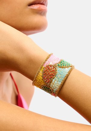Beaded cuff bracelet featuring colorful sequins in yellow, pink, blue, and green, with intricate patterns and gold-toned accents.