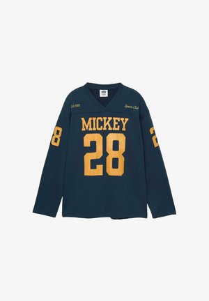 Dunkelblaue Sportjacke mit langen Ärmeln und gelbem Text "MICKEY 28", "Est. 1928", "Sports Club" sowie der Nummer 28 an beiden Ärmeln.