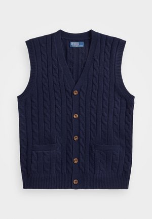 Vest tricotat bleumarin cu un model de sârmă, decolteu în V și cinci nasturi maro. Dispune de două buzunare frontale și brațe largi. Material texturat.