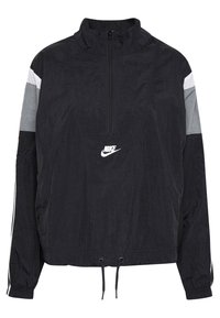 Svart vindjacka med halvdragkedja, grå och vita färgblockeringar, dragsko i nederkant och broderad Nike-logga på bröstet.
