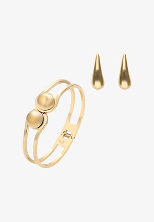 Brățară cu ton auriu, având două elemente sferice, design deschis și elegant, cu suprafață netedă și lustruită; asortată cu cercei picătură în ton auriu.