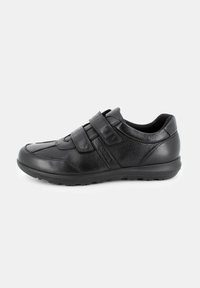 Scarpe di pelle nera con due cinturini in Velcro, punta arrotondata, dettagli testurizzati e suola in gomma per una maggiore durabilità. Design leggero e imbottito.