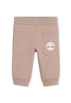 Jogging en mélange de coton beige avec une taille côtelée, deux poches arrière et un logo blanc sur la poche droite. Coupe standard.