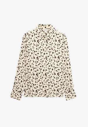 Crèmekleurig overhemd met lange mouwen, knopen aan de voorkant, een brede kraag en een onregelmatig zwart polkadotpatroon, plat uitgevouwen op een witte achtergrond.