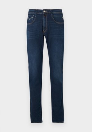 Dark blue denim jeans with a straight-leg cut, featuring contrast stitching, a front button closure, and five-pocket design.