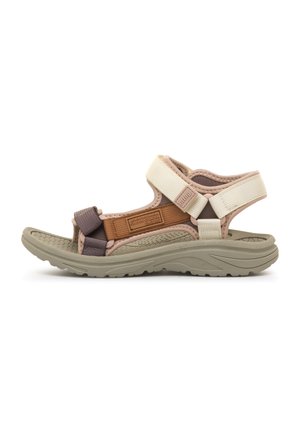 Sandale extérieure beige et marron à bout ouvert avec des brides velcro ajustables et une semelle en caoutchouc texturée pour l'adhérence et le confort.
