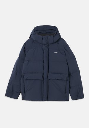 Navy blue puffer jacket with a hood, featuring two large front pockets and a zip closure. Material appears smooth and insulated.