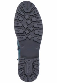 Semelle en caoutchouc noir avec un motif de semelle texturé, comportant des rainures profondes et des détails hexagonaux. Fermeture éclair sur le côté pour un enfilage facile. Taille 37.
