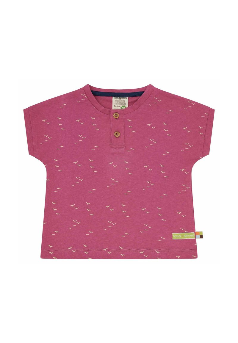 Pink short-sleeve shirt with a round neck, featuring small white bird patterns and two wooden buttons at the neckline. Tag on the side.