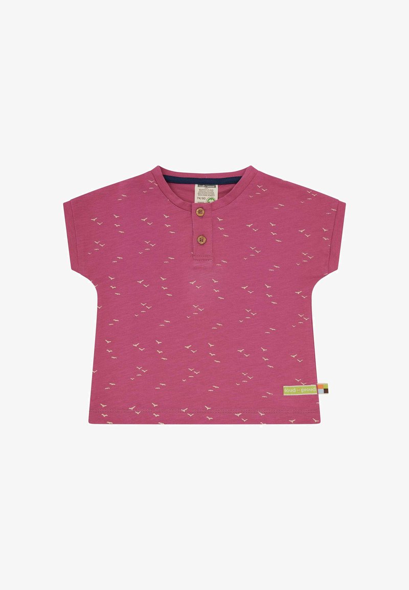 Pink short-sleeve shirt with a round neck, featuring small white bird patterns and two wooden buttons at the neckline. Tag on the side.