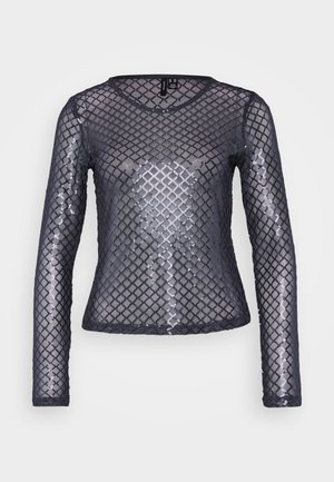 Halenka s dlhými rukávmi vyrobená z priesvitného čierneho sieťového materiálu so vzorom z diamantových flitrov. Má okrúhly výstrih a priliehavý strih.