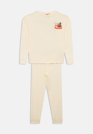 Set de pijamale crem cu mâneci lungi, având un mic desen pe piept. Material din bumbac moale, cu croială lejeră și talie elastică la pantaloni.