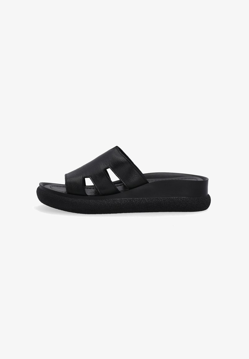 Black leather slide sandal featuring three cutouts, a smooth upper, and a textured black sole for added grip and comfort.