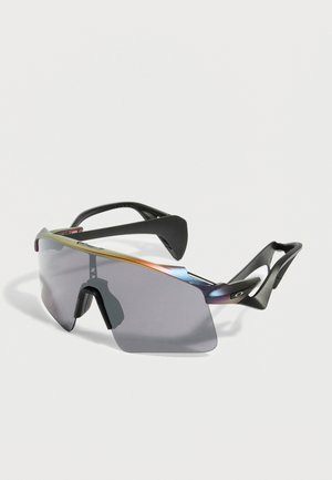 Sporty wraparound sunglasses with gray tinted shield lens and black angular temples on a plain white background.