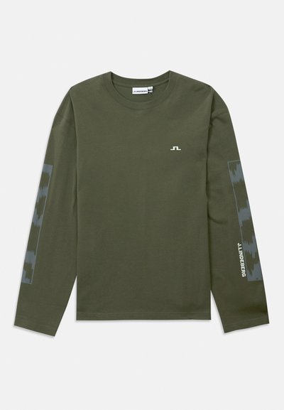 Long-sleeve olive green T-shirt made of cotton, featuring a small white logo on the chest and a patterned grey accent on the sleeves.