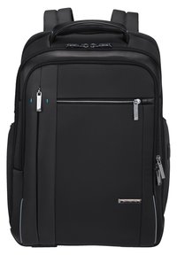 Zaino nero realizzato in materiale testurizzato, dotato di una tasca frontale con zip, chiusura a doppia zip, spallacci imbottiti e dettagli riflettenti.