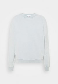 Felpa azzurra chiara con scollo rotondo, maniche lunghe e polsini e orlo a coste. Materiale in cotone morbido con una finitura leggermente strutturata.
