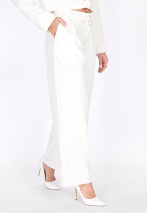 - Spodnie materiałowe