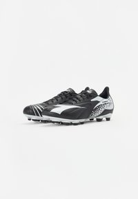 Black soccer cleats with a sleek design, featuring textured leather, white accents, and a pixelated pattern on the heel.
