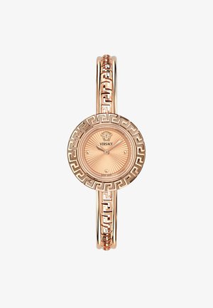 Rose gold wristwatch with a circular patterned face, featuring a Greek key design on the bracelet and a detailed logo at the center.