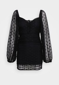 Musta mekko, jossa on pilkkuverkkosinetti puff-hihat, rypistetty vartalo, nauha kauluksessa ja teksturoitu kangas, joka esittelee tiukan siluetin.