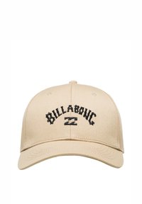 Beige baseballová čepice s kulatou korunou, černě vyšívaným logem "BILLABONG" a zakřiveným kšiltem. Vyrobena z bavlněné směsi.