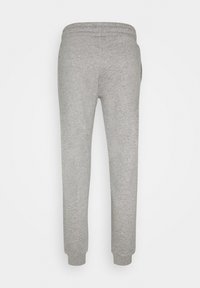 Grey sweatpants made of soft fabric, featuring an elastic waistband and cuffed ankle hems, with a smooth, slightly textured surface.