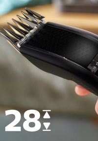 Zwarte haartrimmer met meerdere verstelbare kamattachments, slank ontwerp, gestructureerde grip en een digitaal display dat een aanpassingsniveau van 28 aangeeft.