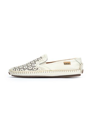 Slip-on leather shoe with cut-out floral pattern, cream color, contrasting stitching, and a rounded toe. Lightweight design suitable for casual wear.