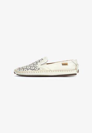 Slip-on leather shoe with cut-out floral pattern, cream color, contrasting stitching, and a rounded toe. Lightweight design suitable for casual wear.