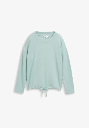 Jasnoniebieska bluzka z długim rękawem, wykonana z teksturowanej tkaniny. Ma okrągły dekolt oraz ściągacz u dołu, co pozwala na regulację dopasowania.