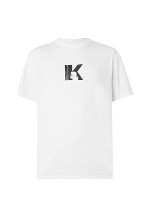 T-shirt bianca in cotone con stampa grafica nera con la lettera "K" e un design a silhouette sul petto. Maniche corte, vestibilità rilassata.