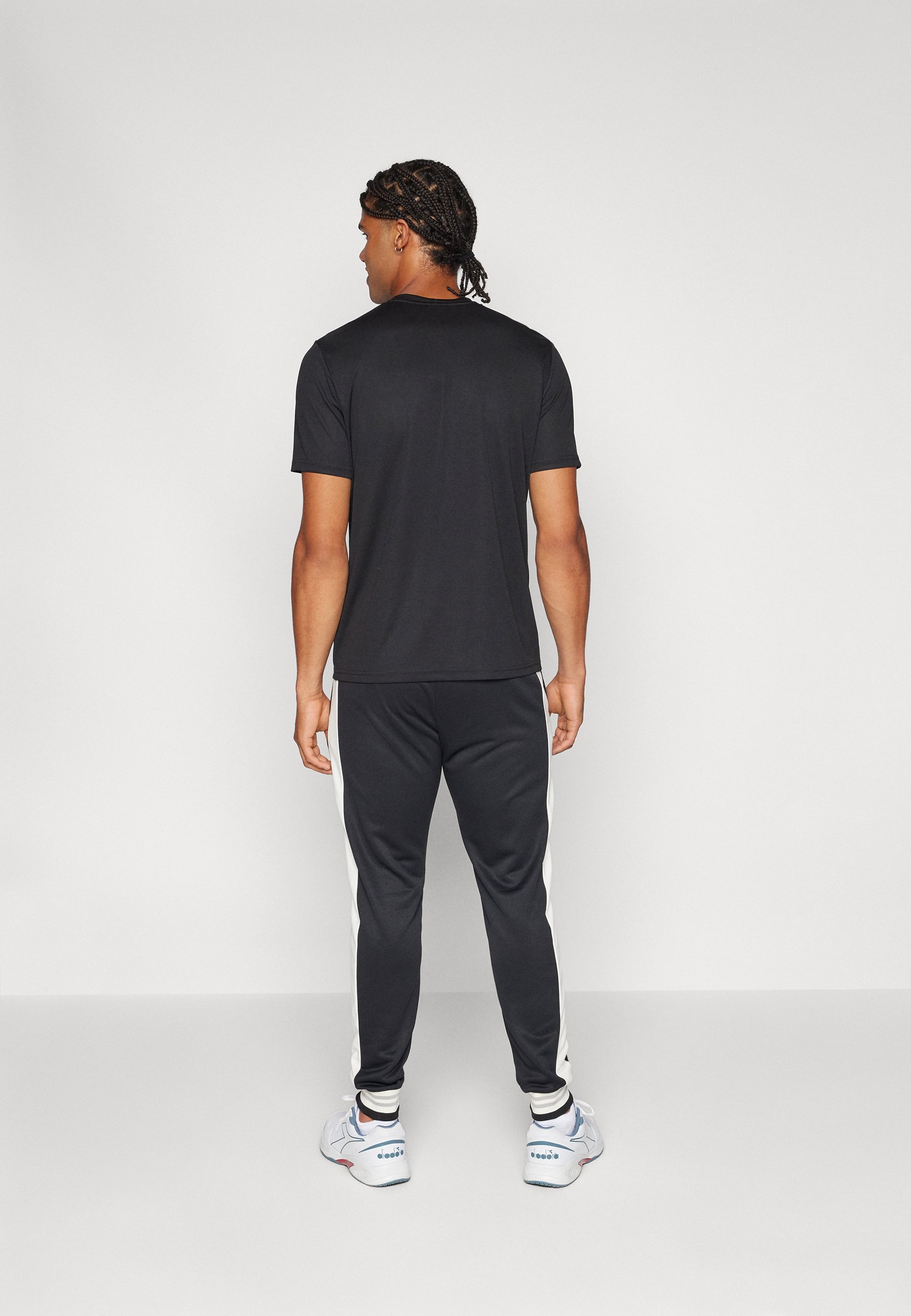 Fila PANTS BAME - Tracksuit bottoms - black/white alyssum/black -  Zalando.co.uk