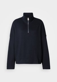 Suéter pullover azul-marinho com um alto pescoço tipo mock, zíper de um quarto, mangas largas e um tecido suave e texturizado. Design minimalista sem padrões.