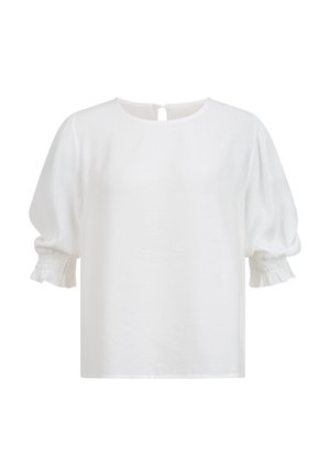 Blouse blanche avec manches bouffantes jusqu'au coude et poignets élastiqués à volants, encolure ronde avec fermeture boutonnée au dos.