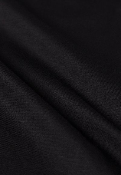 Black fabric with a smooth, matte texture, displaying subtle weave patterns. The surface appears even and consistent in color.