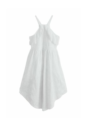 White sleeveless summer dress with eyelet embroidery, halter neck, and asymmetrical hem.