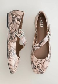 Snakeskin-patterned, pink flat shoes with a rounded toe, X-strap design, silver buckle detail, and a low black heel.
