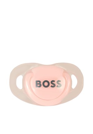 Pink pacifier with a glossy finish, featuring a circular shape and the word "BOSS" in silver, bordered by clear plastic side handles.