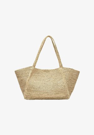 Borsa a mano in paglia intrecciata beige con base larga e manici lunghi, adatta per uso casual o da spiaggia.