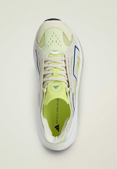 White and lime athletic shoe with mesh upper, blue accents, lace closure, perforations for ventilation, and textured rubber sole.