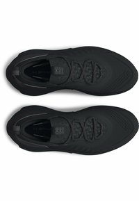 Black athletic shoes featuring a textured upper, prominent lacing system, and a sleek design with perforated accents for breathability.