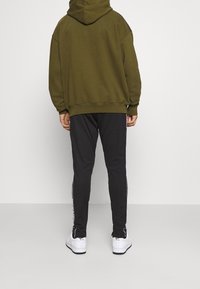 Pegador Träningsbyxor - black