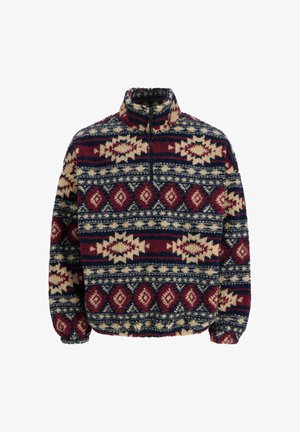 Pull en polaire à demi-zip, arborant des motifs géométriques en marine, bordeaux et beige, avec des poignets élastiques et un col montant.