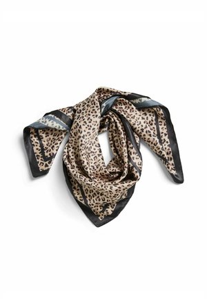 Foulard en soie à imprimé léopard avec des bordures noires, plié négligemment sur fond blanc.